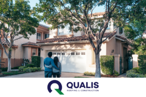 A couple stands in front of a two-story house with a garage, observing the home. As homeowners contemplating essential tips for roof maintenance, they notice the Qualis Roofing & Construction logo displayed at the bottom of the image.